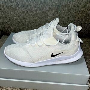 White Nike running shoes.